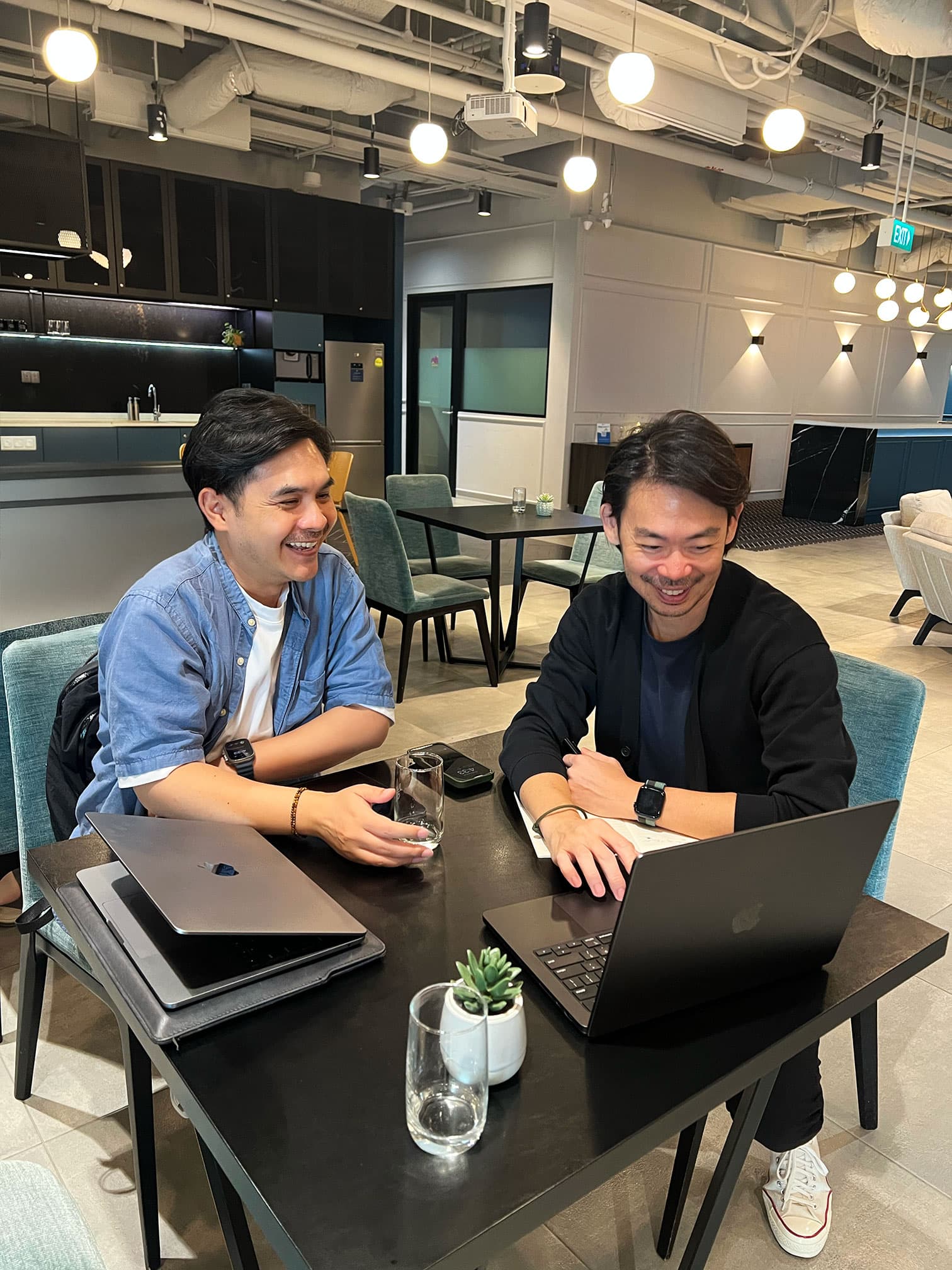 Au-Rin, founder of SMBee, working with business partner Gerald